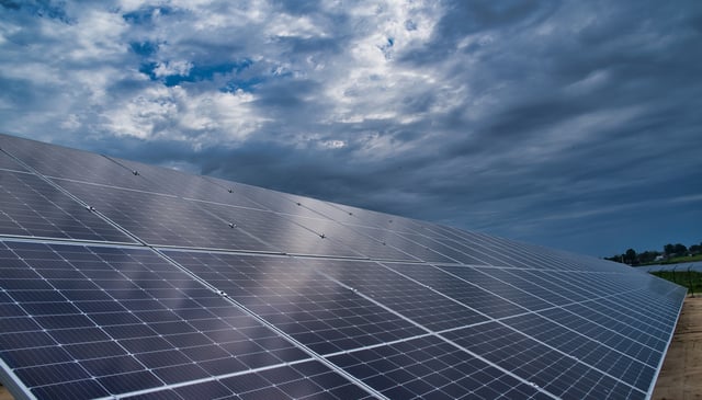 solar farm under clouds