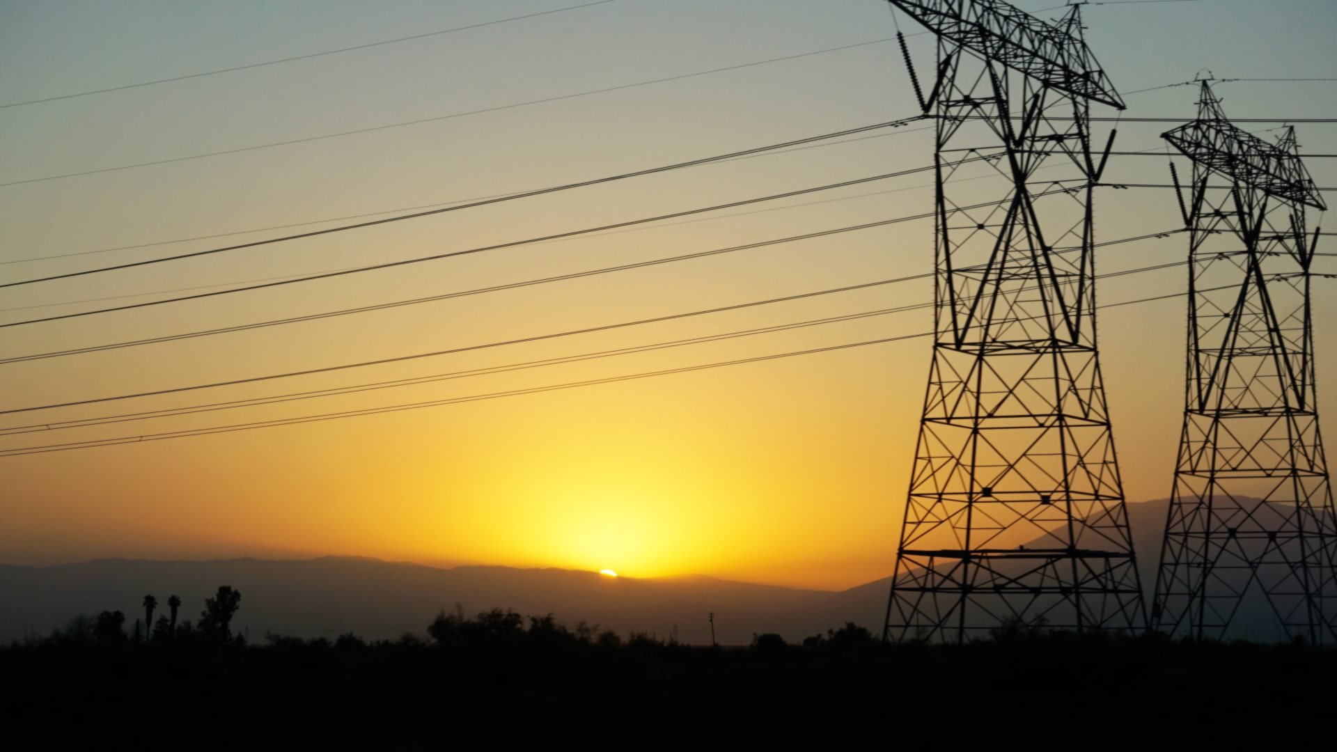 Sunrise over transmission lines