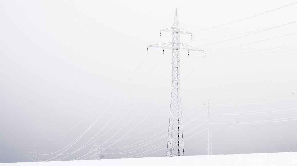 Utility structure shrouded in freezing fog