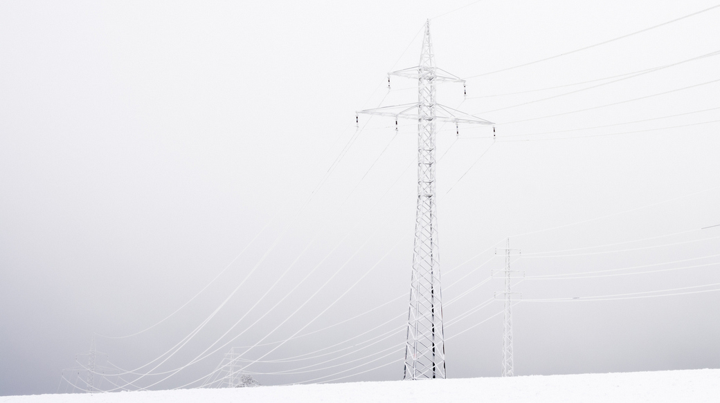 Utility structure shrouded in freezing fog
