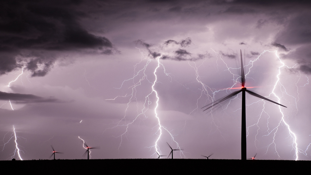 Lightning at a wind farm at night