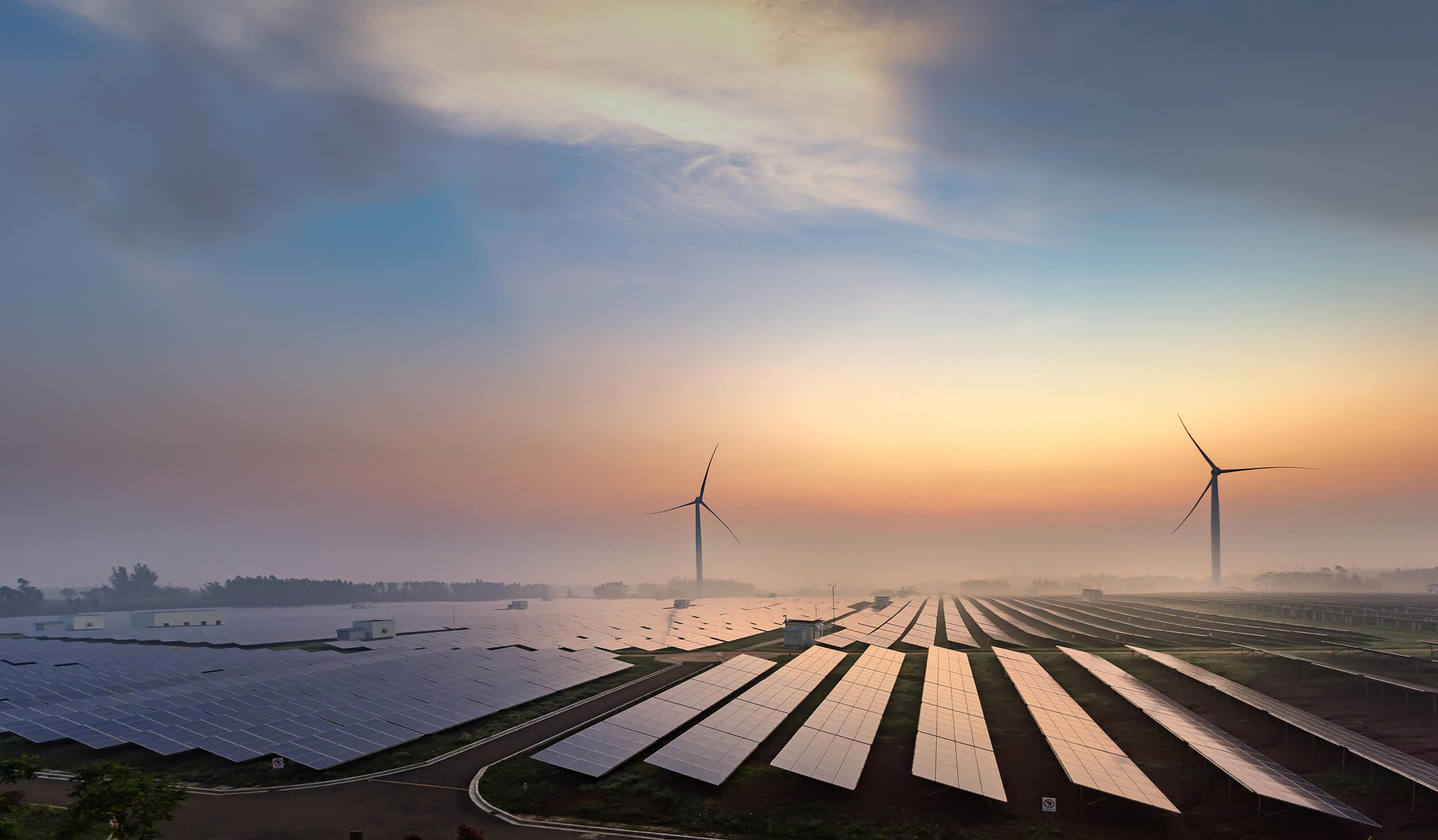 wind and solar farm at dusk wind and solar farm at dusk