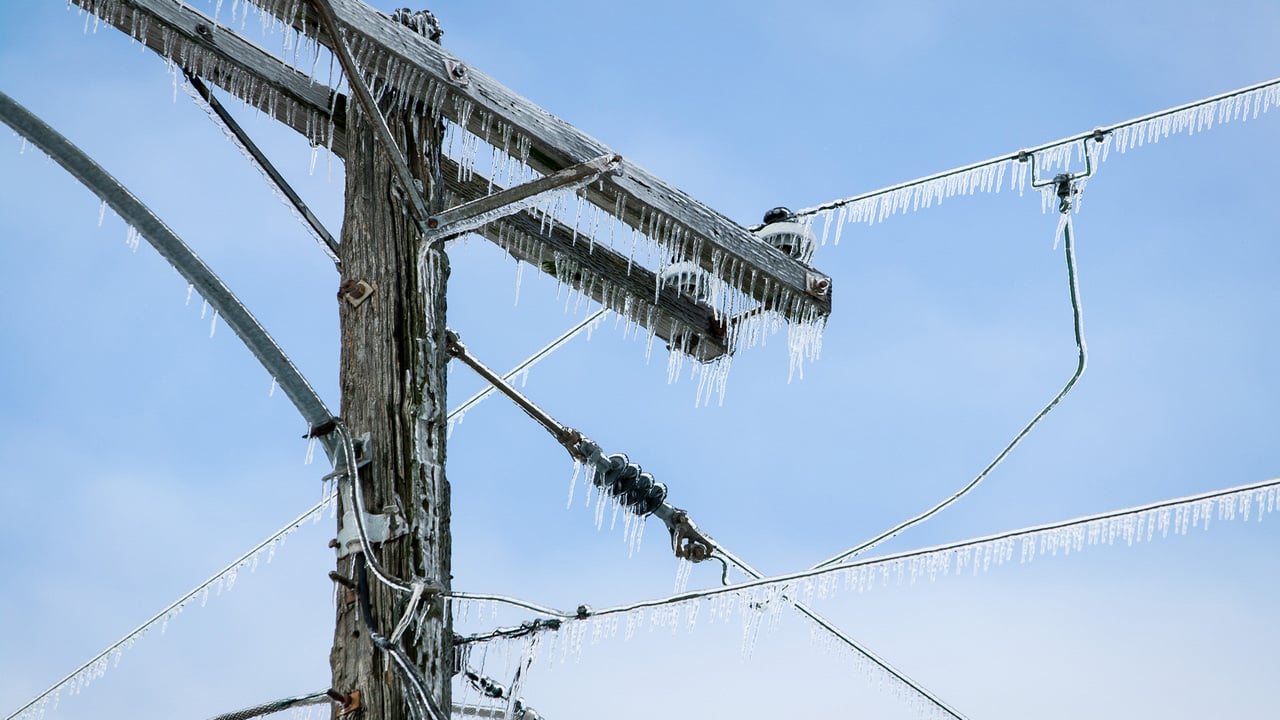 Heavy ice on utility pole and lines